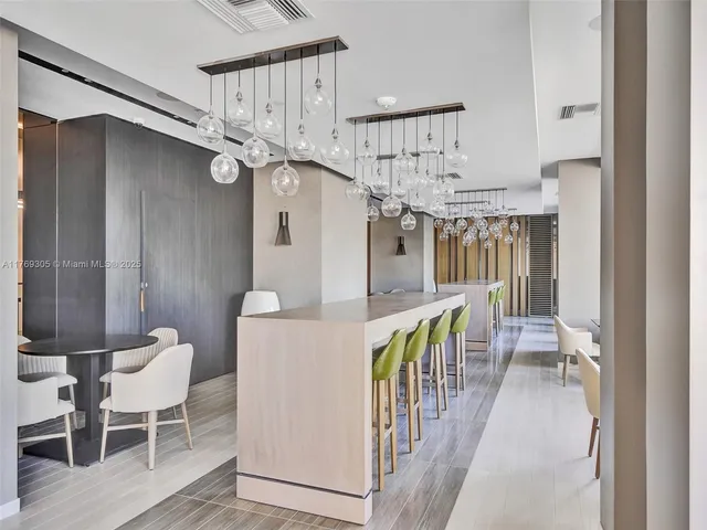 a view of entryway and hall with dining room