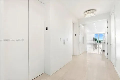 a view of a bathroom with a glass door shower