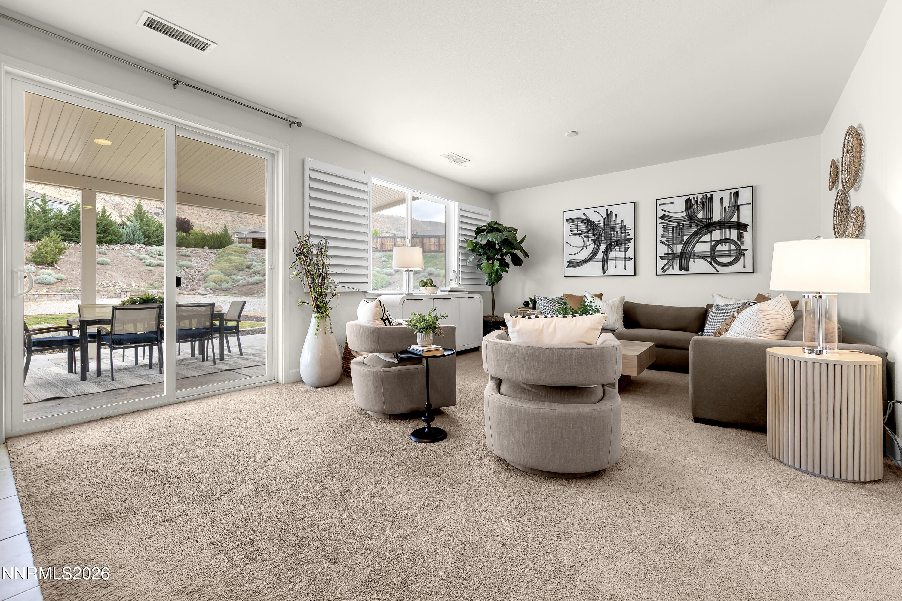 10150 Barrel Racer Drive Reno, NV 89521 - Photo 6 of 64 a living room with furniture and a large window