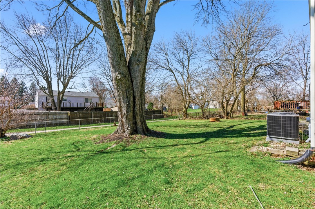 707 West Martindale Road Union, OH 45322 - Photo 24 of 28 This spacious yard offers a serene setting with mature trees and ample green space for outdoor enjoyment.