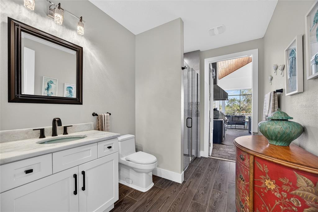 28991 Smugglers Lane Punta Gorda, FL 33982 - Photo 20 of 67 a bathroom with a toilet sink and mirror
