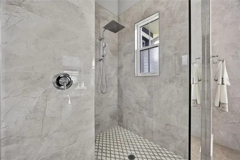 a bedroom with a bed and a table