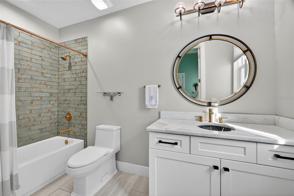 28991 Smugglers Lane Punta Gorda, FL 33982 - Photo 30 of 67 a bathroom with a toilet a sink and a mirror