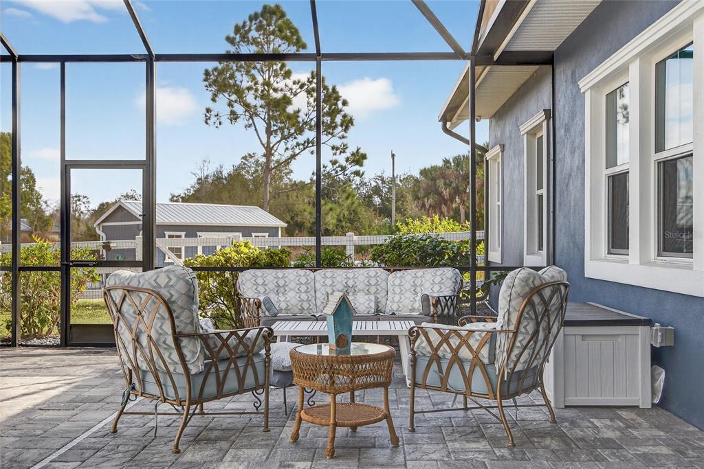 28991 Smugglers Lane Punta Gorda, FL 33982 - Photo 44 of 67 a view of a patio with a table chairs and a potted plant
