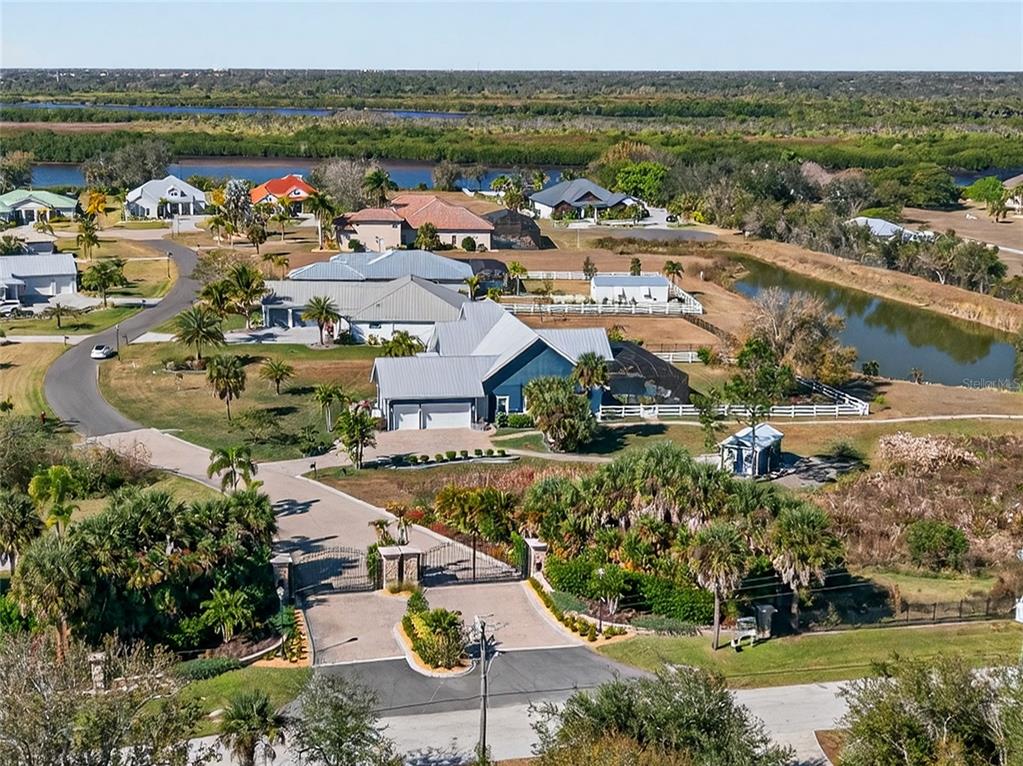 28991 Smugglers Lane Punta Gorda, FL 33982 - Photo 51 of 67 an aerial view of a city with lots of residential buildings lake and ocean view