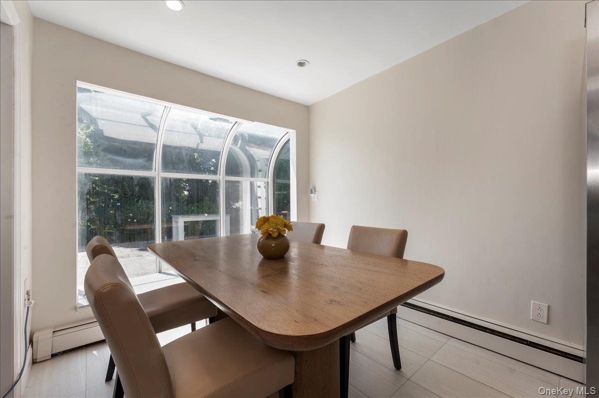 70 Longfellow Road Great Neck, NY 11023 - Photo 11 of 28 a view of a dining room with furniture and window