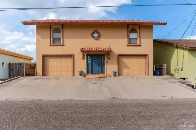 a front view of a house with a garage