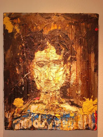 a bedroom with bed and painting on the wall