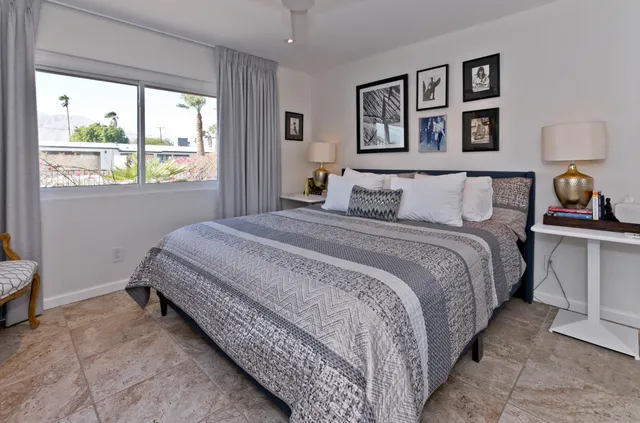a large kitchen with stainless steel appliances kitchen island granite countertop a sink and cabinets