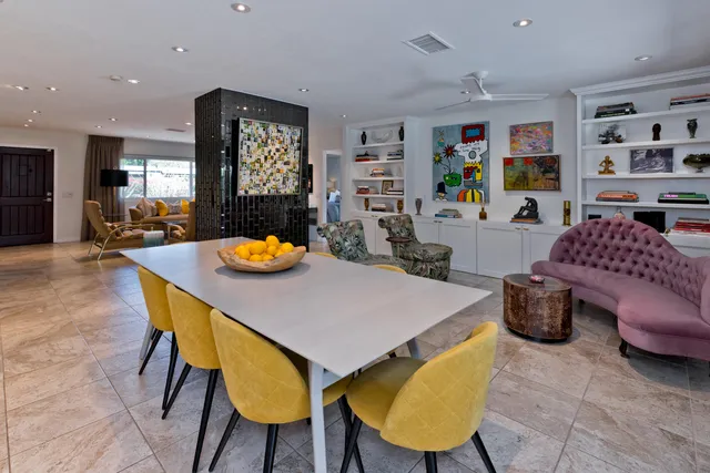 a view of swimming pool with seating area and barbeque oven