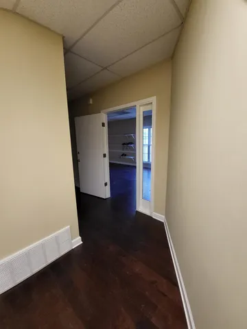 an empty room with wooden floor