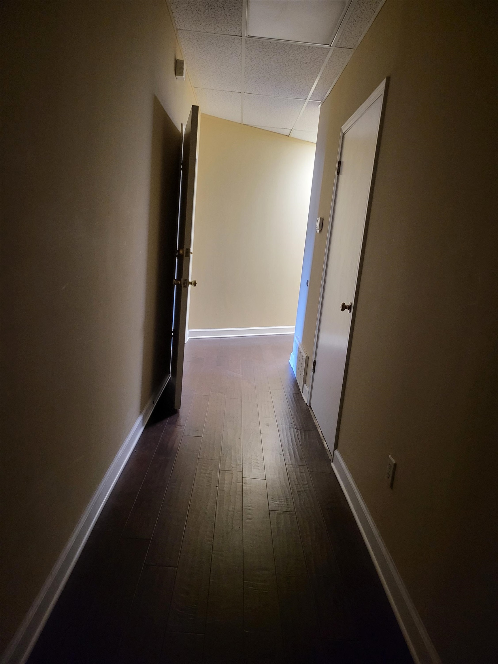 811 Timber Creek Drive, Unit SUITE 817 Memphis, TN 38018 - Photo 8 of 14 a view of a hallway with wooden floor and stairs