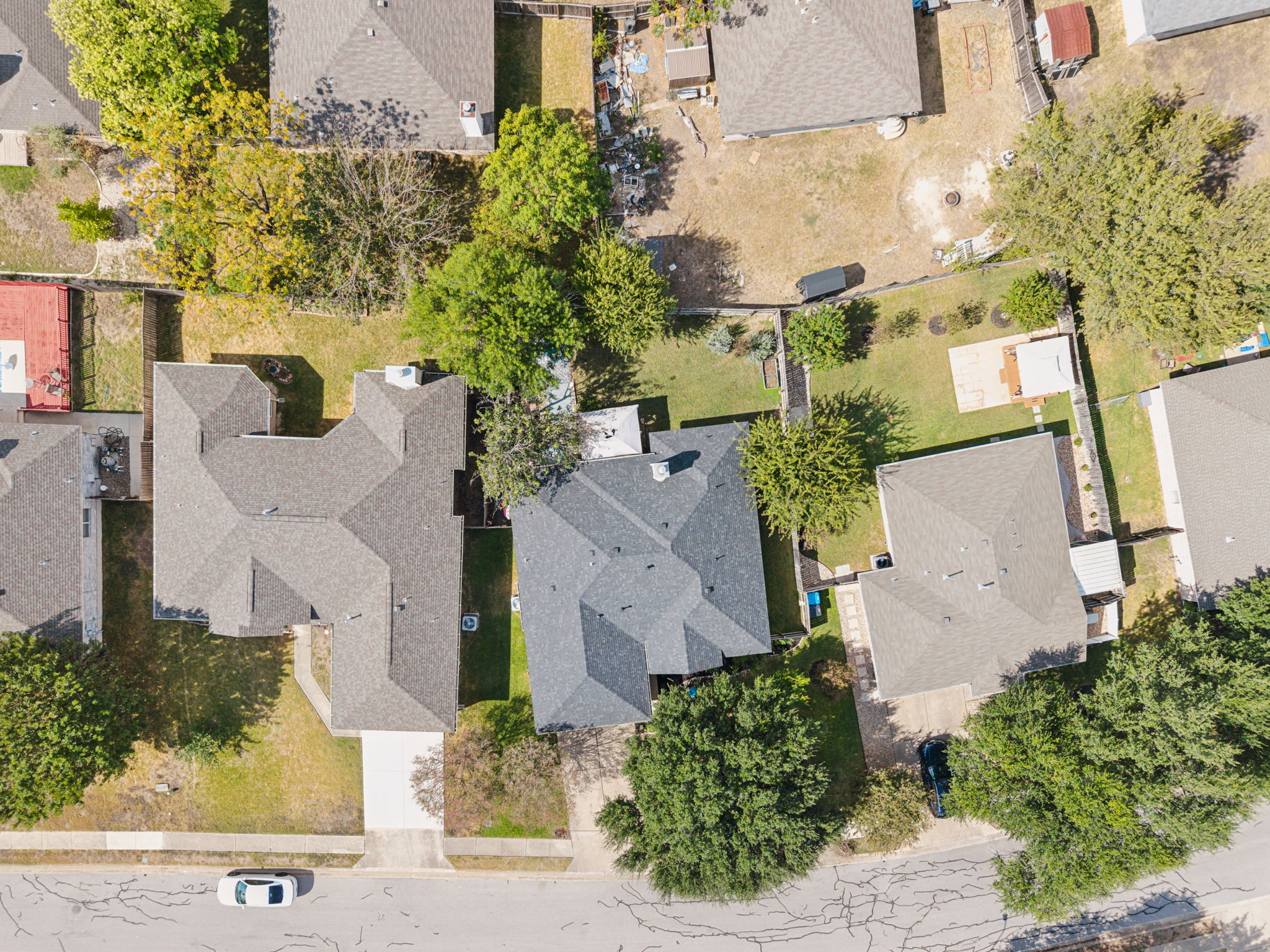 2412 Chestnut Path Round Rock, TX 78664 - Photo 24 of 26 An aerial perspective showcases a residential street lined with houses featuring shingle roofs and established landscaping.