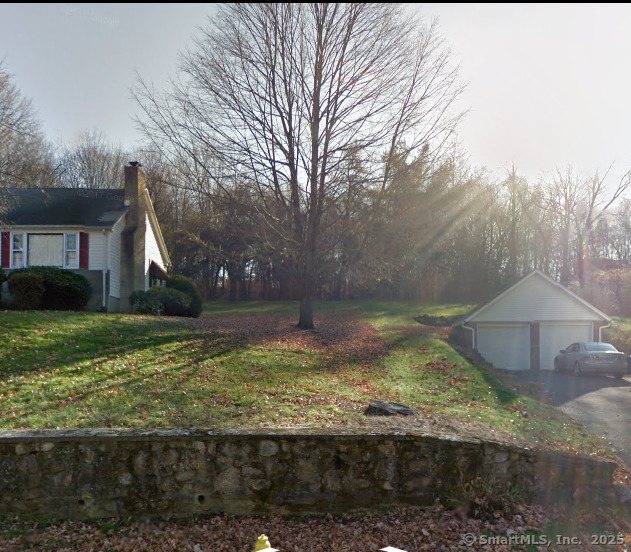 a view of a backyard with green space