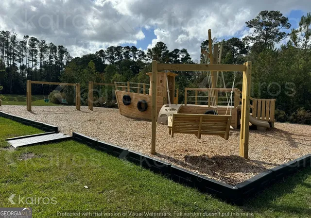 a view of a backyard with sitting area
