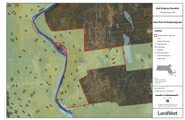 a view of a lush green hillside and a building