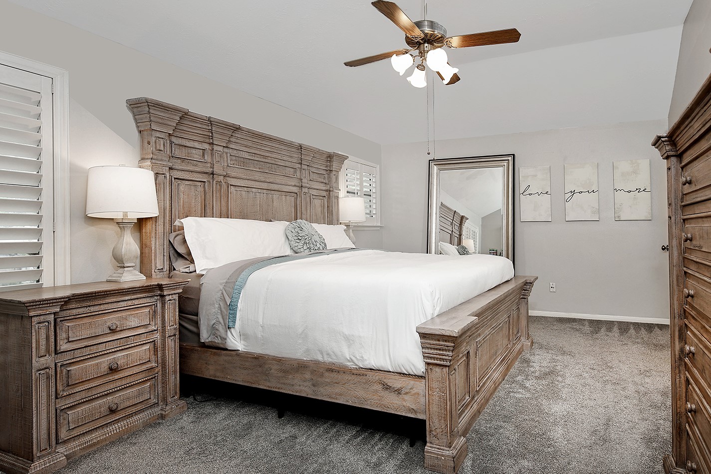 2619 Knollbrook Lane Spring, TX 77373 - Photo 15 of 27 a bedroom with a bed and a chandelier