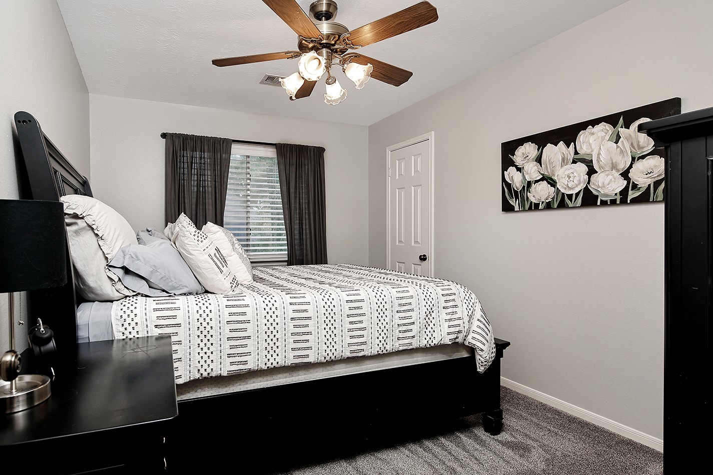 2619 Knollbrook Lane Spring, TX 77373 - Photo 19 of 27 a bedroom with a bed and dresser