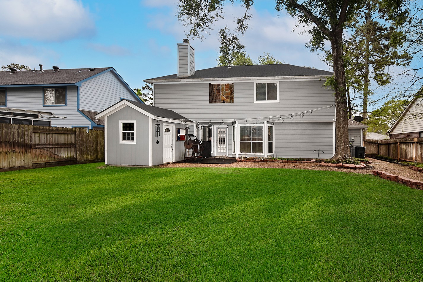 2619 Knollbrook Lane Spring, TX 77373 - Photo 22 of 27 a front view of a house with a garden