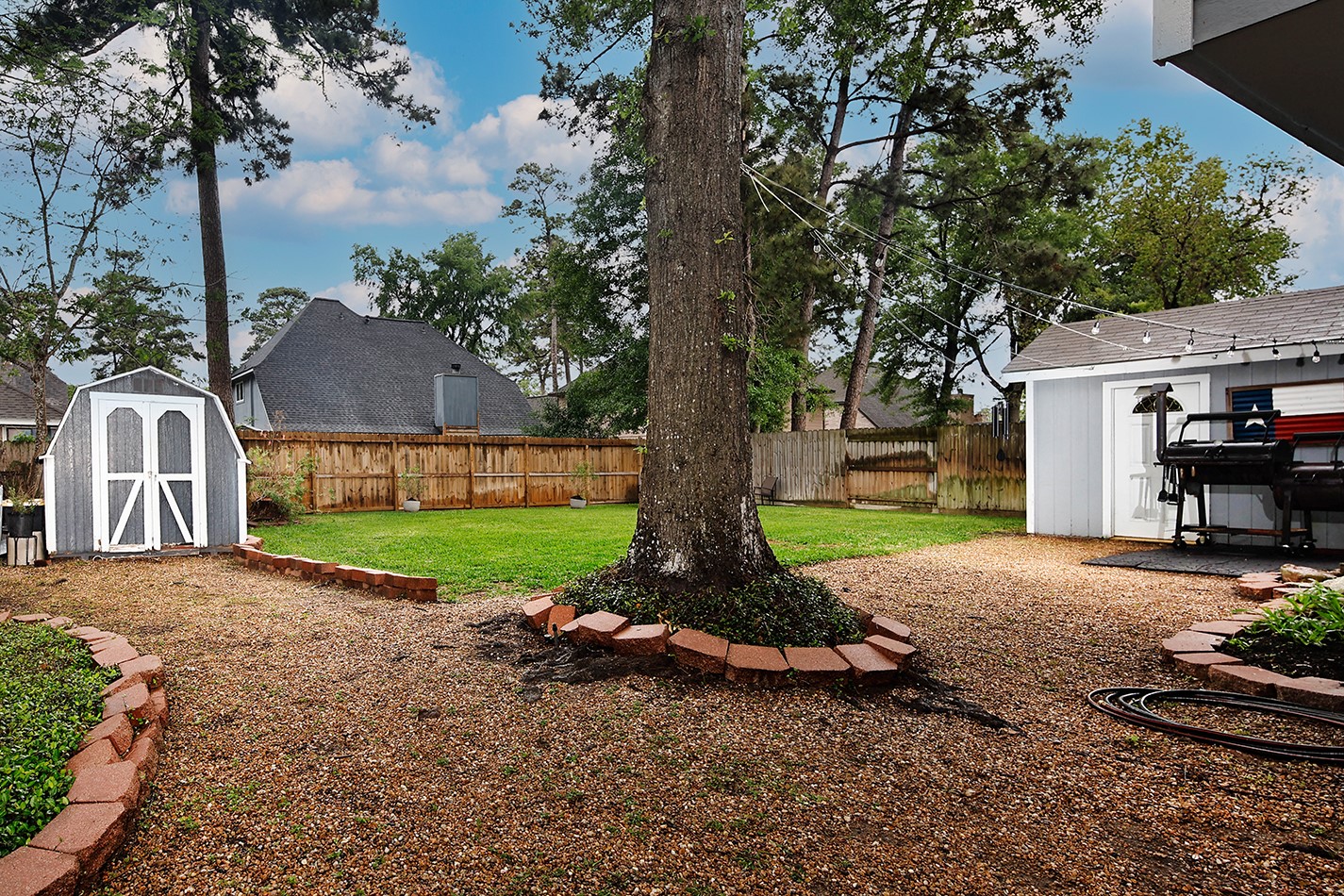 2619 Knollbrook Lane Spring, TX 77373 - Photo 24 of 27 a view of a house with backyard and a tree