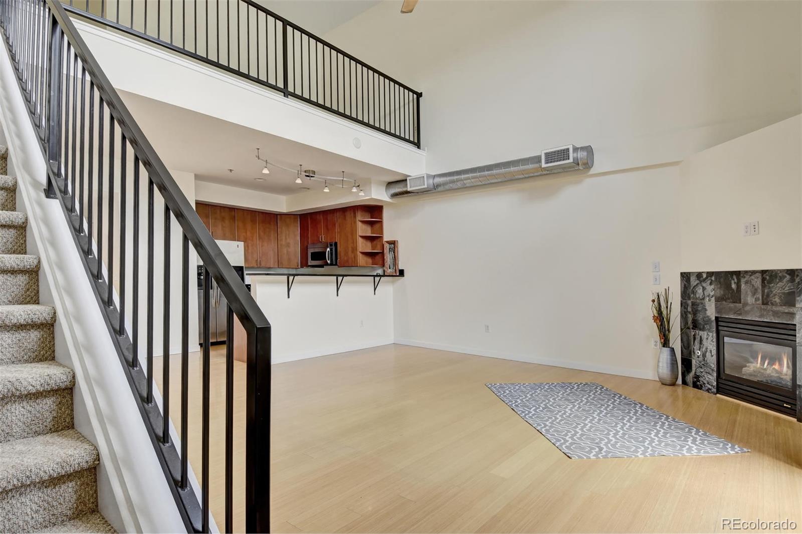 4520 Broadway, Unit 210 Boulder, CO 80304 - Photo 13 of 36 a view of hallway with stairs and wooden floor
