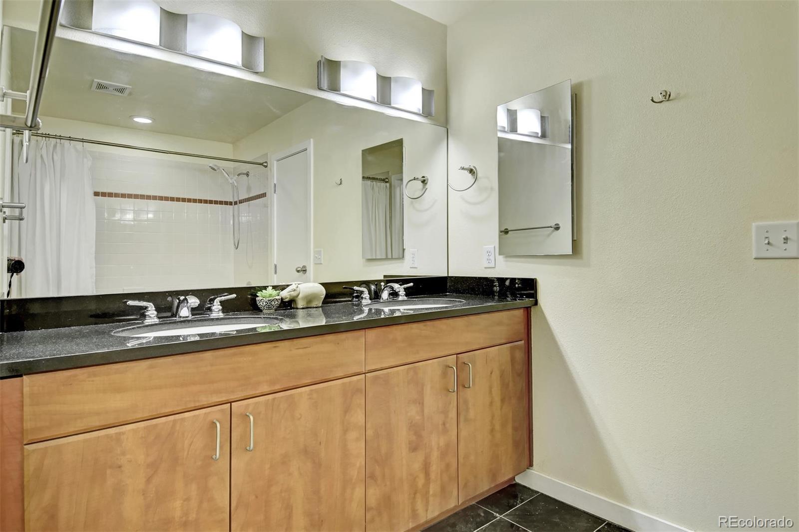 4520 Broadway, Unit 210 Boulder, CO 80304 - Photo 17 of 36 a bathroom with a sink and a mirror