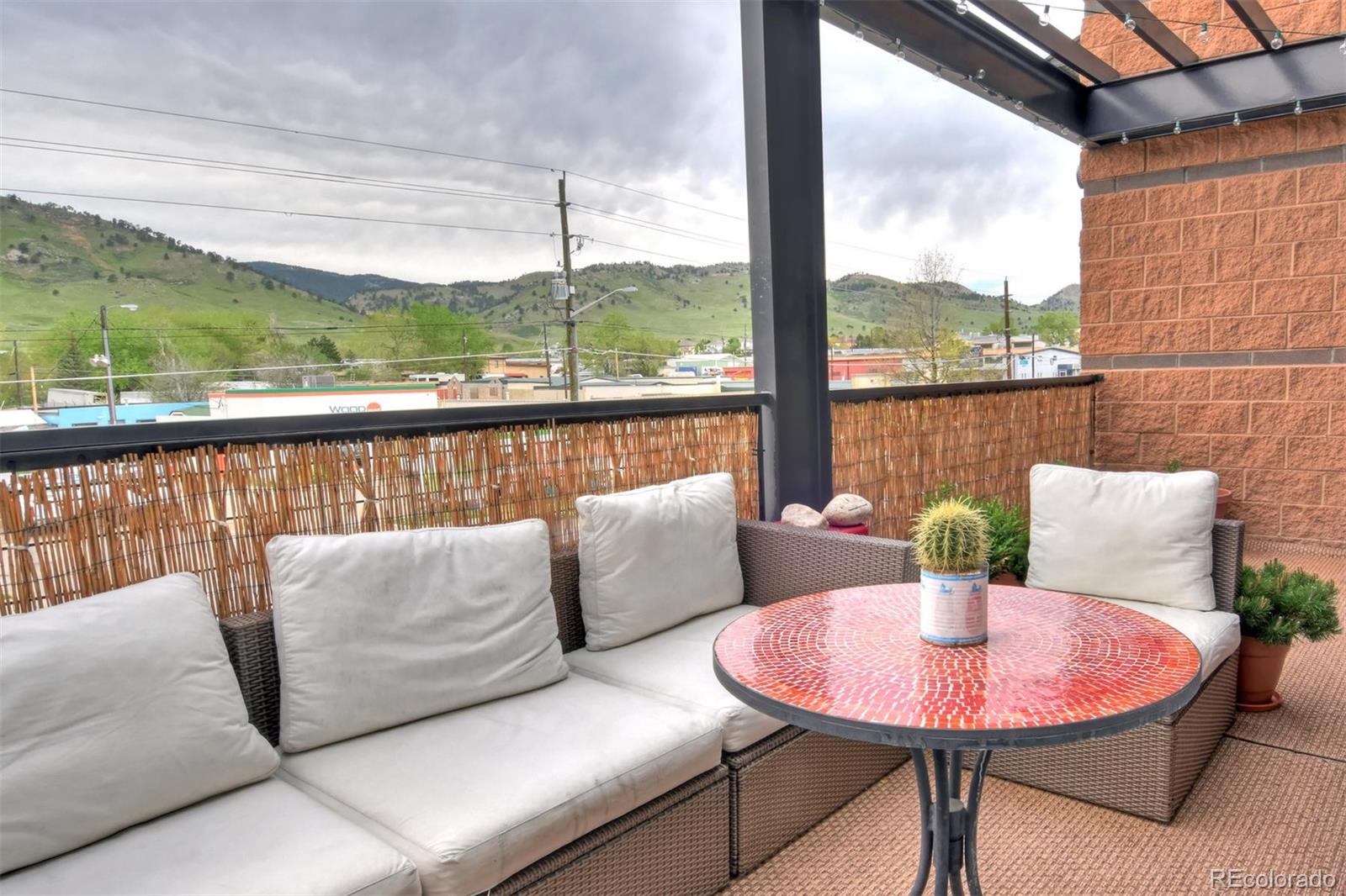 4520 Broadway, Unit 210 Boulder, CO 80304 - Photo 22 of 36 a balcony with furniture and a view of lake