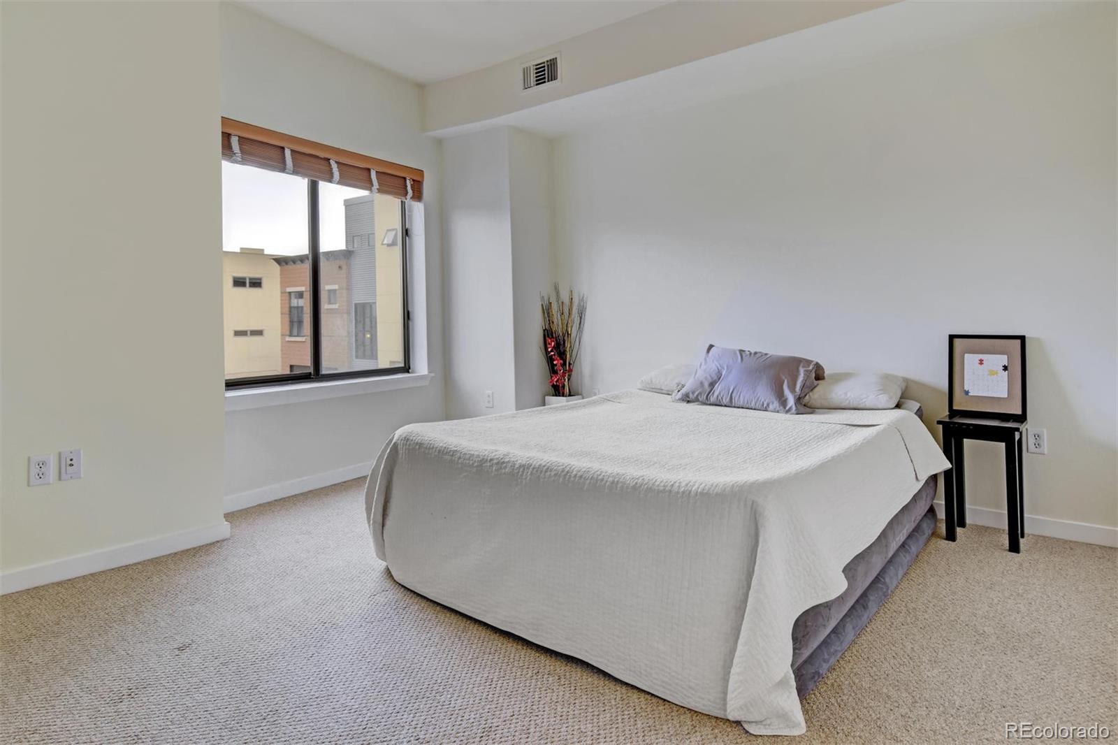 4520 Broadway, Unit 210 Boulder, CO 80304 - Photo 23 of 36 a bedroom with a bed and window