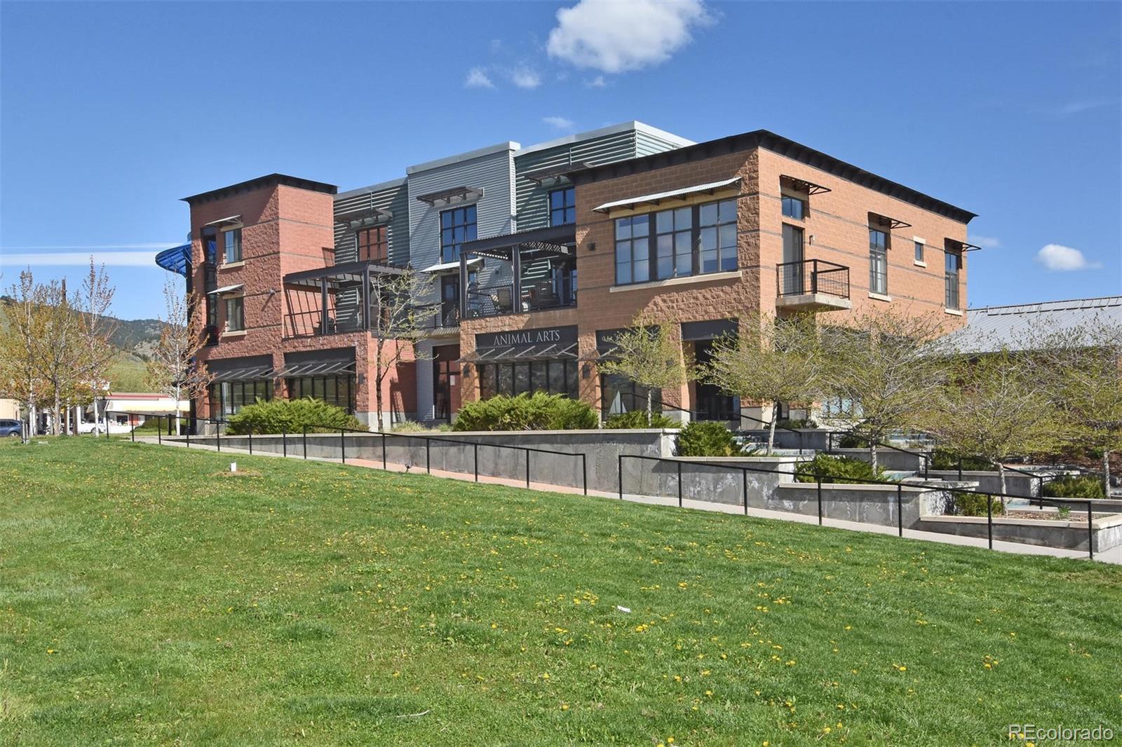 4520 Broadway, Unit 210 Boulder, CO 80304 - Photo 26 of 36 a front view of a house with a yard