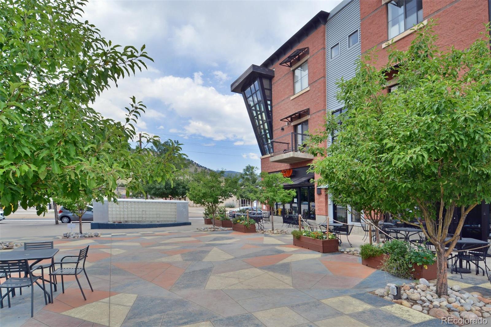 4520 Broadway, Unit 210 Boulder, CO 80304 - Photo 34 of 36 a view of a patio with a table and chairs and potted plants