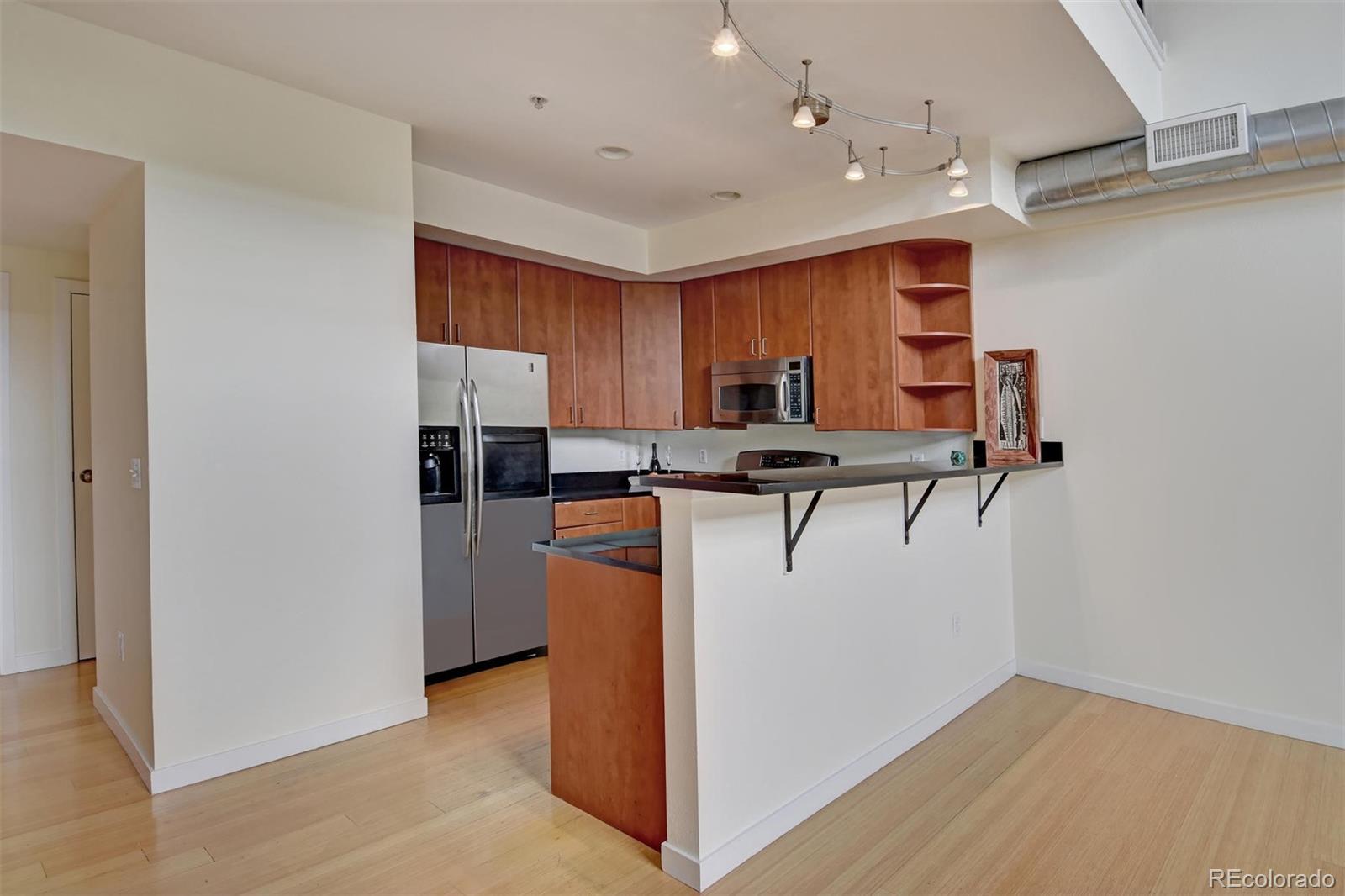 4520 Broadway, Unit 210 Boulder, CO 80304 - Photo 7 of 36 a view of kitchen with cabinets and microwave