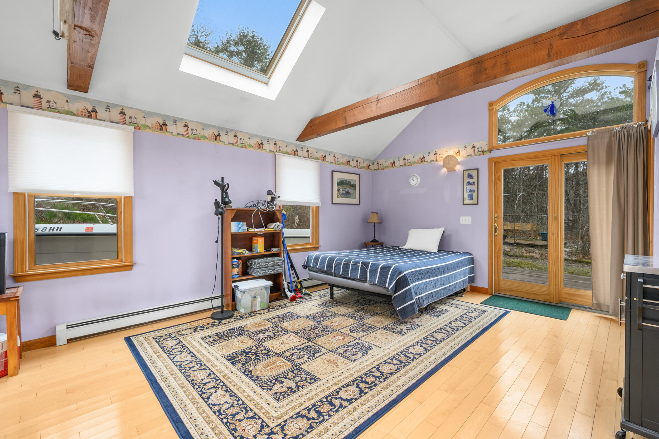 2 Short Lots Lane Truro, MA 02666 - Photo 18 of 61 a bedroom with a bed and wooden floor