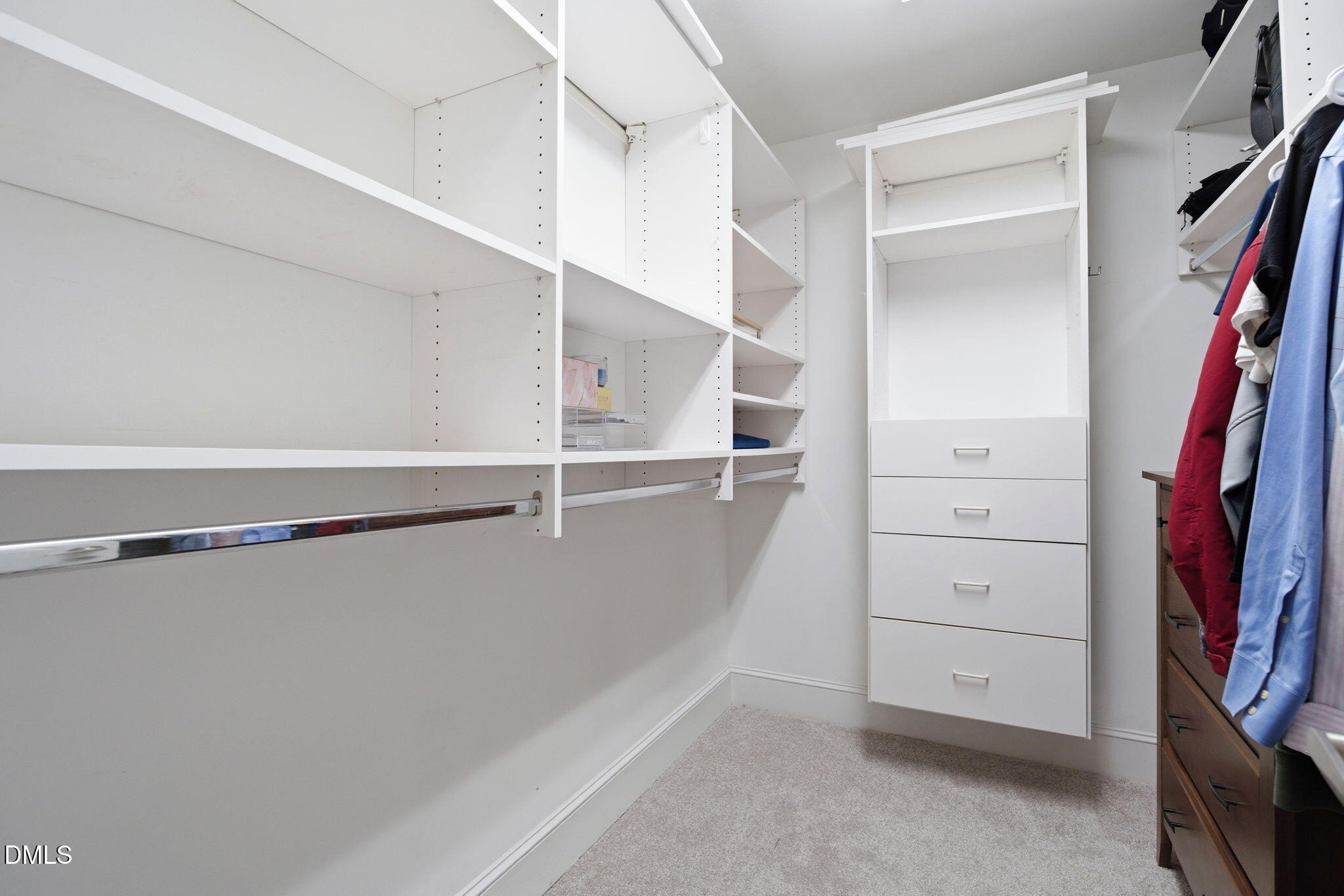 5416 Pulley Town Road Zebulon, NC 27597 - Photo 29 of 74 a view of walk in closet with empty racks