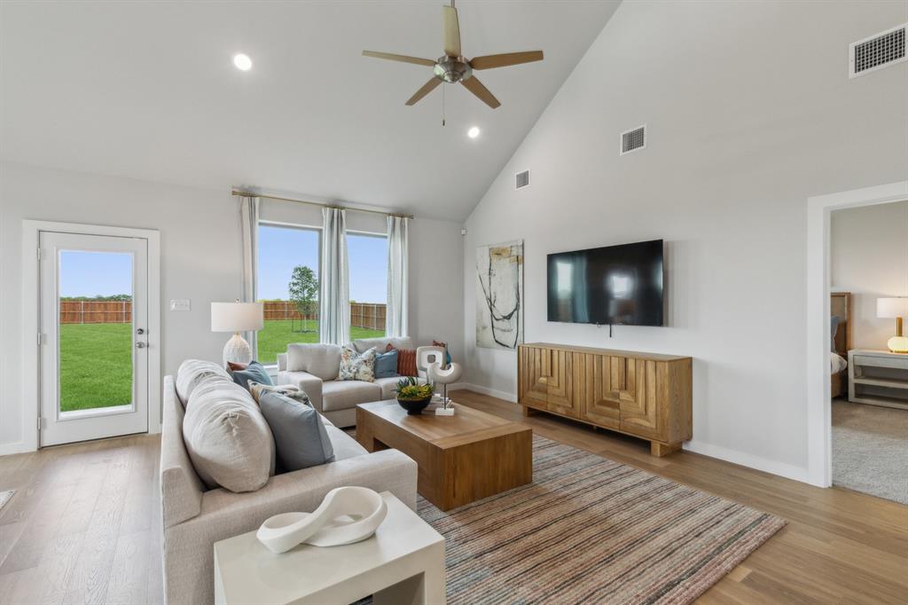 667 Sierra Ridge Lavon, TX 75166 - Photo 11 of 25 Living Room in the Winters home plan by Trophy Signature Homes – REPRESENTATIVE PHOTO
