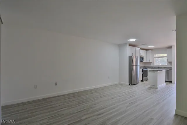 a view of kitchen with wooden floor