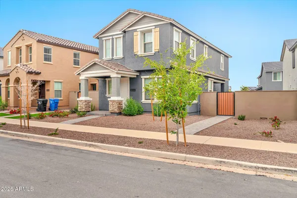 a front view of a house with a yard and a garage