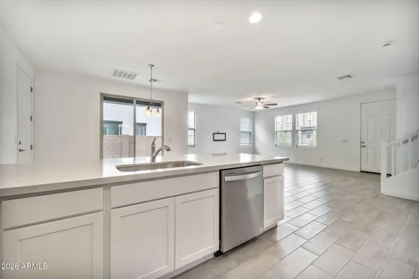 a view of staircase with white walls