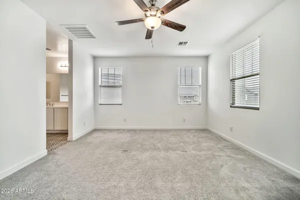a bathroom with a double vanity sink and mirror