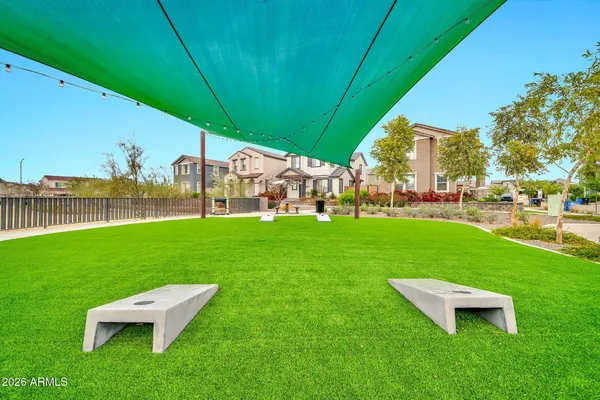 a view of a palm trees front of the house
