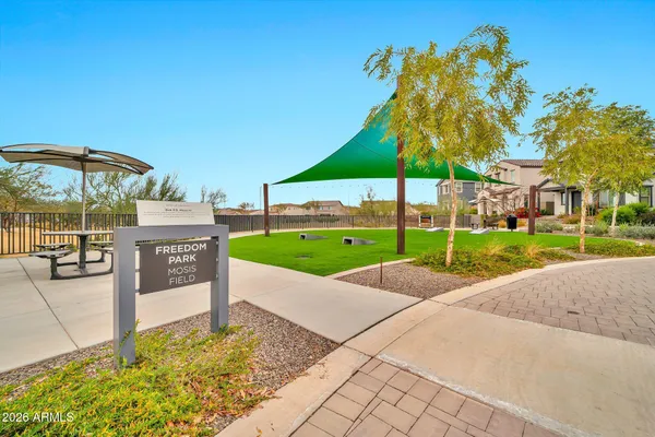 a swimming pool with outdoor seating and yard