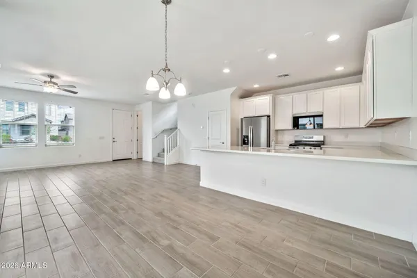 a view of kitchen with cabinets and wooden floor