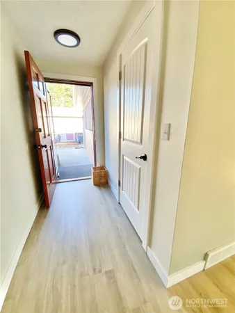 a view of entryway with wooden floor