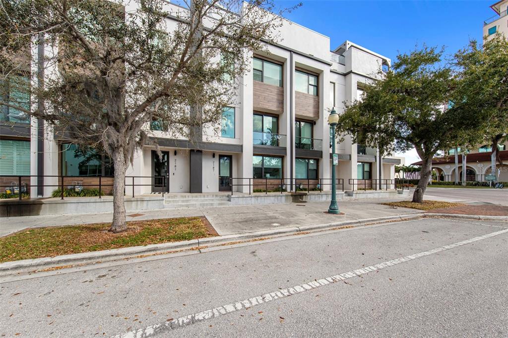 2187 Main Street Sarasota, FL 34237 - Photo 1 of 46 a view of a white house with a large tree