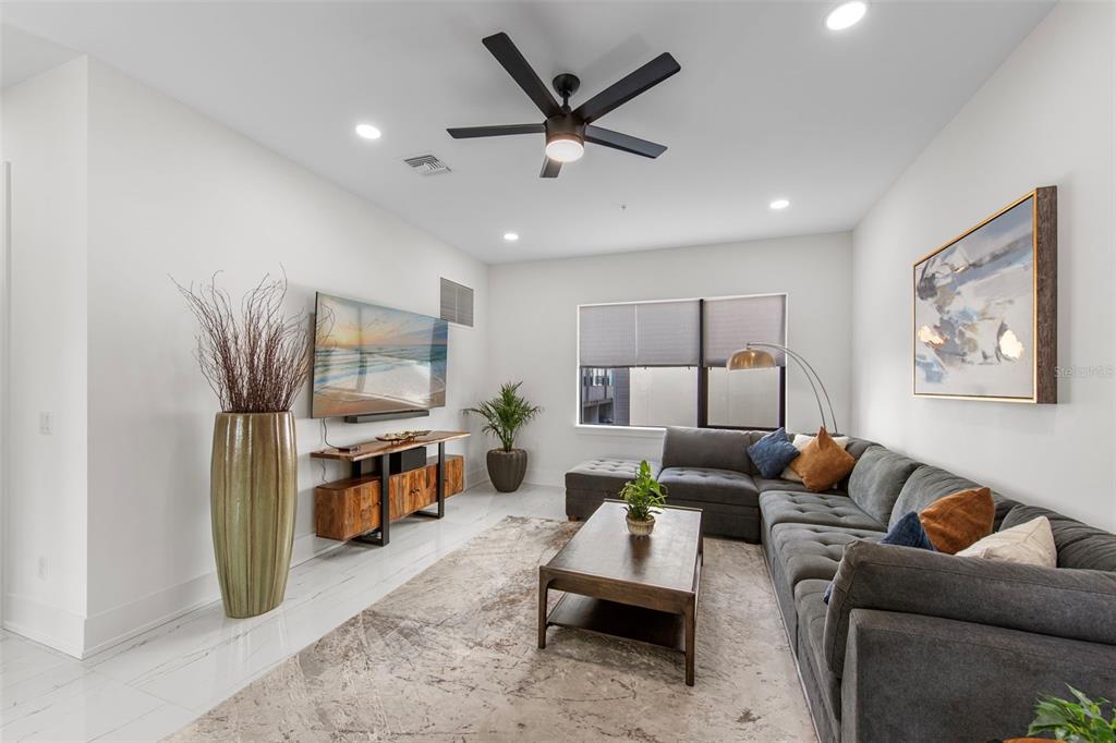 2187 Main Street Sarasota, FL 34237 - Photo 23 of 46 a living room with furniture and a flat screen tv