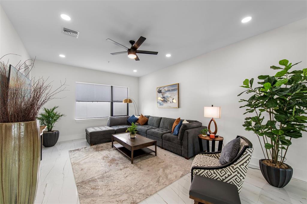 2187 Main Street Sarasota, FL 34237 - Photo 24 of 46 a living room with furniture potted plant and a lamp