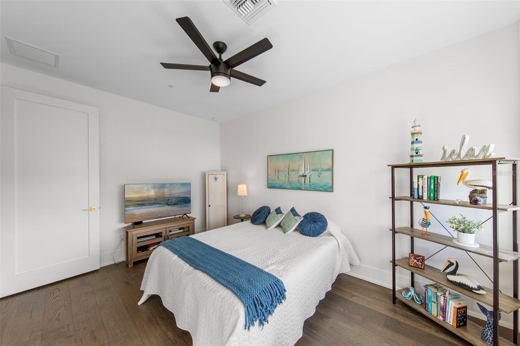 2187 Main Street Sarasota, FL 34237 - Photo 26 of 46 a bedroom with a bed a flat screen tv and dresser
