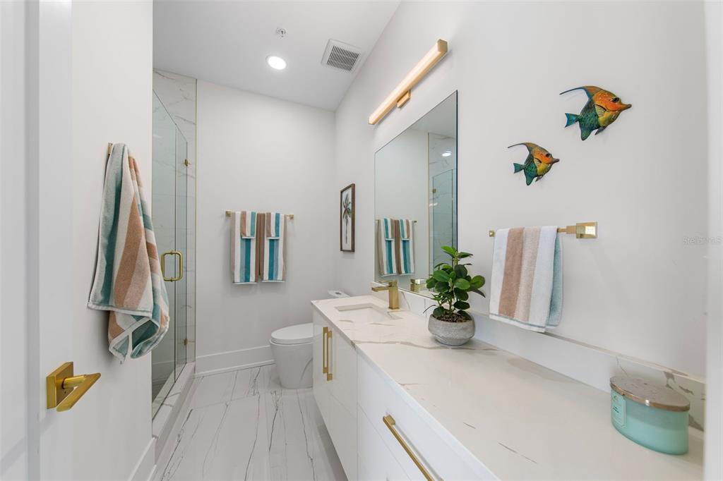 2187 Main Street Sarasota, FL 34237 - Photo 29 of 46 a bathroom with a sink a toilet and a mirror