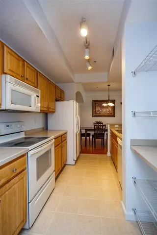 a kitchen with stainless steel appliances granite countertop a stove and a sink