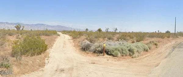 a view of mountain view with mountains in the background