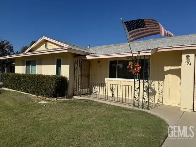 a front view of a house with glass windows